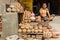 Indian man selling clay pots on local workshop in Bikaner. Rajasthan. India