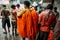 Indian man wearing marigold galant for sell at Mullick Ghat flower market in the morning in Kolkata, India