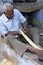 Indian man working with wood in the street, Bundi, India