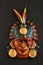 Indian Mayan Aztec ceramic mask with feather on black