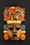 Indian Mayan Aztec wooden carved painted mask on black