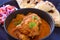 Indian meal-Chicken Curry served with salad and roti