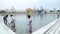 Indian men cleaning pool water in front of the Golden temple in Amritsar.