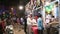 Indian men by a street stand at market in Jodhpur in night time.