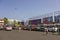 Indian men wait near the parked bright colorful buses at the bus station