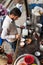 Indian milkman prepares the popular drink lassi in Blue lassi shop