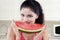 Indian model biting a piece of watermelon