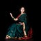 Indian mood. Sitting beautiful young woman posing in a sari dress.