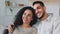 Indian multiracial couple ethnic married family bearded man ethnic woman husband and wife hugging cuddling affectionate