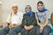 Indian Muslim man and woman with scarf in Durban South African airport with their Muslim granddaughter