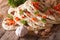 Indian Naan flat bread with garlic and herbs closeup. horizontal