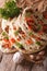 Indian Naan flat bread with garlic and herbs closeup. Vertical