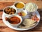 Indian Non-Veg Thali / food platter consists variety of veggies,Chicken meat, lentils, sweet dish, snacks etc., selective focus