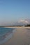 Indian Ocean coastline with palm trees, white sand and azure waters in the Maldives