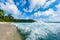 Indian Ocean Waves Spray and beach in Background. Seychelles, Mahe Island.