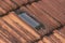 An Indian old fashioned roof tiles with a light tile for proper lighting facilities in the day time.