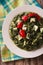 Indian Palak Paneer Spinach with cheese and spices close-up. Vertical top view