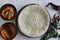 Indian pancakes also known as dosa made with fermented batter of rice and lentils. Served with idli podi chutney, sambar, coconut
