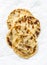 Indian paratha flatbread on a light background, top view