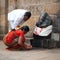 Indian people brings offerings to Ganesha at Gangaikonda Cholapuram Temple. India, Tamil Nadu, Thanjavur (Trichy)