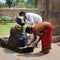 Indian people brings offerings to Nandi Bull at Gangaikonda Cholapuram Temple