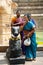 Indian people brings offerings to Nandi Bull at Gangaikonda Cholapuram Temple