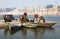 Indian people crossing the Ganges river