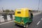 Indian people driving tricycle taxi on the street for send passengers and foreign travelers with traffic road at New Delhi, India