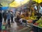 Indian people are standing near fruit shops (Press Photograph)