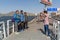 Indian people take photos with European tourist on the street in Ajmer. India