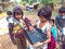 indian poor girl giving training about laptop computer system at village area open class in india January 2020