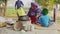 Indian poor woman in village cooking food with traditional way