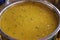 Indian popular food Dal fry or traditional Dal Tadka Curry served in ceramic bowl.