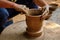 Indian potter hands at work, Shilpagram, Udaipur, Rajasthan, India