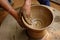 Indian potter hands at work, Shilpagram, Udaipur, Rajasthan, India