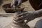 An Indian potter makes earthen lamps or â€˜diyasâ€™ ahead of the forthcoming Diwali festival