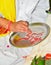 Indian priest preparing for worship during a ceremony in Hindu religion family