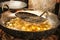 Indian puri tortillas. National delicacy cooked in boiling oil in a cauldron, New Delhi, India