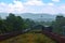 Indian rail carriage waiting in its shed with a beautiful mountain in the background