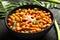Indian recipe -Homemade spicy chickpea curry in black bowl
