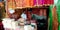 an indian religious shop vendor standing into the store in India aug 2019