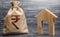 Indian rupee INR symbol money bag and house. Real estate purchase and investment. Affordable loan, mortgage. Taxes, rental income