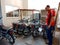 an indian salesmen presenting hero bike model in the showroom for sale in india January 2020