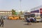 Indian school children on the background of multi-colored buses at the bus station on the