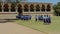 Indian Schoolgirls with Teacher Walk across Palace Green Yard