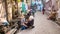 An Indian sculptor working on an idol of the Hindu Goddess Durga in an alley in the