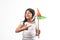 Indian small girl and tricolour face holding windmill made up of saffron, green and white colour paper, happy independence or repu