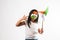 Indian small girl and tricolour face holding windmill made up of saffron, green and white colour paper, happy independence or repu