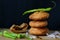 Indian snack kachori served with green chilli and onions in a black background