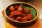 indian snack, spices marinated and deep fried tender chicken cubes, known as chicken 65